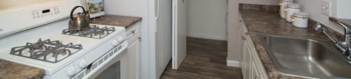Galley Kitchen with White Cabinets at Town Walk at Hamden Hills, Hamden, CT, 06518