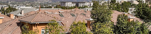 the view of the city from the roof of a house