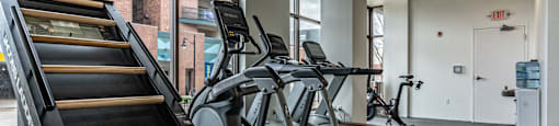 cardio equipment at the district flats apartments in lenexa