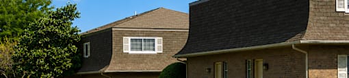 A house with a driveway in front of it.