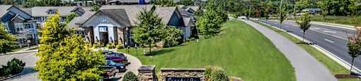 A sign in front of a building that says "Crossroads".