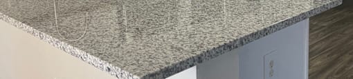 a kitchen with a granite counter top and