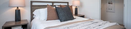 The Byway | Model #105 Beautiful Primary Bedroom Shown With Queen Sized Bed and Two Nightstands