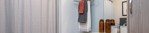 The Byway | Model #105 Bathroom Boasts Plenty of Storage and Curved Shower Rod