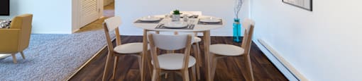 a dining room with a table and chairs and a ceiling fan