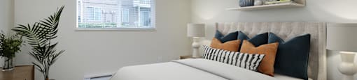 A bedroom with a large bed and a window.