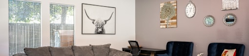 a living room with a couch and a table and chairs