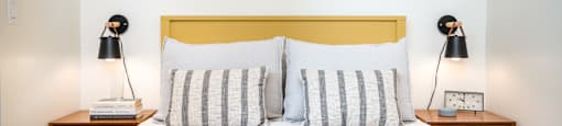 Studio Apartments in Eugene OR - Crosswood Apartments - Bedroom with White Walls, Plush Bed, and Two Night Stands