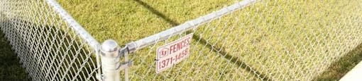 a fenced in yard with a no trespassing sign on the fence