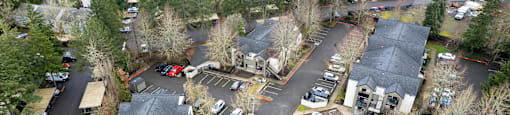 A bird's eye view of a residential area with houses and cars.