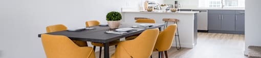 Two BR Apartments in Oregon City OR - Timberview Apartments and Townhomes - Dining Area Adjacent to the Kitchen with Modern Dining Set for 6 and Wood-Style Flooring