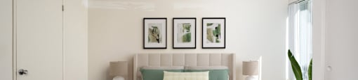 a bedroom with white walls and a bed with green pillows
