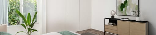 a bedroom with a bed and a large window