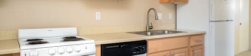 a kitchen with counters with different colored refrigerator doors