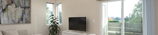 a living room with a couch and a coffee table and a television