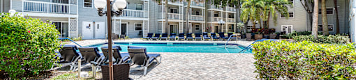 Resort style pool and patio at Aventine at Lantana - 55+ Active Adult Apartments, Lantana, FL