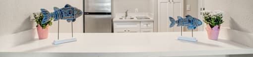 Kitchen with white countertop at Aventine at Lantana - 55+ Active Adult Apartments, Florida