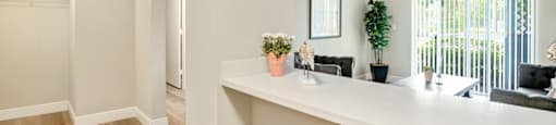 Living room with a long counter at Aventine at Lantana - 55+ Active Adult Apartments, Florida, 33462