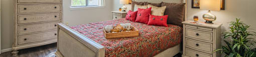 Bedroom with a large bed at Palazzo Senior Apartments - 55+ Active Adult Apartments, Phoenix, AZ