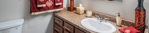 Bathroom with a white toilet at Palazzo Senior Apartments - 55+ Active Adult Apartments, Phoenix, AZ, 85015