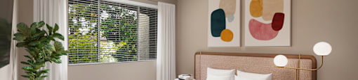 a bedroom with a bed and a ceiling fan
