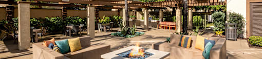 Courtyard with couches and a fire pit