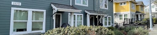 A row of houses with the first one having the number 1129 on it.
