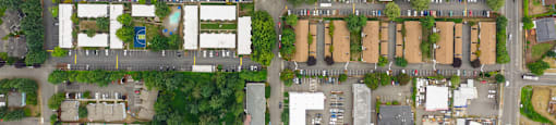 A bird's eye view of a residential area with houses and streets.