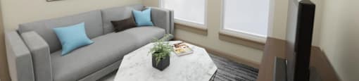 a living room with a gray couch and a white coffee table with blue pillows at The Aries at Bitter Lake Apartments, Washington, 98133