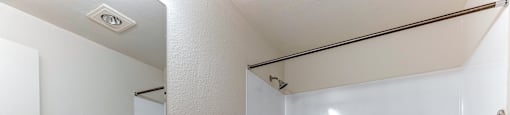 A bathroom with a sink, toilet and bathtub.