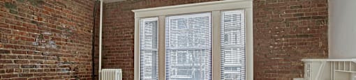 A room with a window and a radiator.