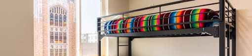 a bunk bed in a room with a window at Arbora Court, Seattle