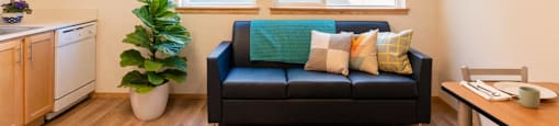 a living room with a couch and a window at Arbora Court, Washington