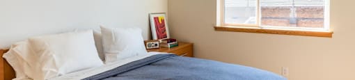 Bedroom with window at Arbora Court, Washington