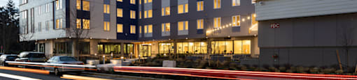 a large building with a street in front of it at The Aries at Bitter Lake Apartments, Washington, 98133