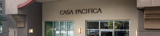 The front of a building with the name CASA PACIFICA on it.