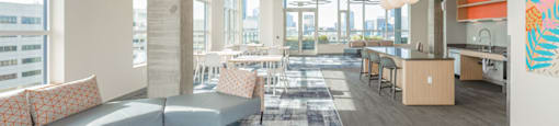 A modern office space with a large open area and a view of the city.