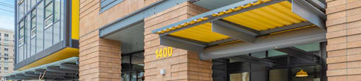 The front of a building with a sign that says
