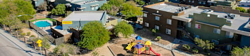 an aerial view of a neighborhood with a playground and houses at Maryland Villas Apartments, Nevada, 89101