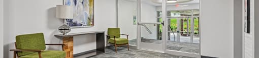 A conference room with a yellow ceiling light and a painting on the wall.