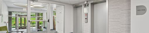A room with a carpeted floor and a white door with a number 101-106 on it.
