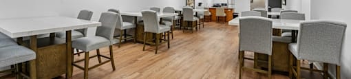 A conference room with a long table and chairs.