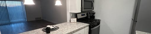 a kitchen with white cabinets and a counter top at Lavale Apartments, Monroeville, PA, 15146