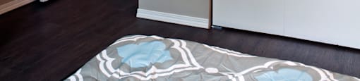 A white door is open to a hallway.