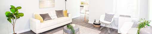 a living room with white walls and a white couch for rent in Manitoba
