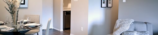 A grey couch with a white blanket is in the corner of a room with a dining table and chairs.