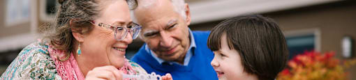a little girl and her grandparents eating ice cream  at Harbor Heights 55+ Community, Olympia