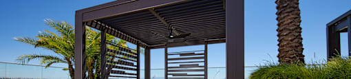 a covered patio with lounge chairs and a pergola