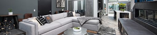 a living room filled with furniture and a large window