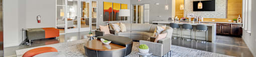 a living room with couches and chairs and a fireplace